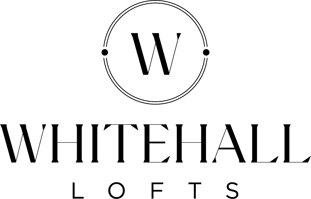 Whitehall Lofts logo with a green background.